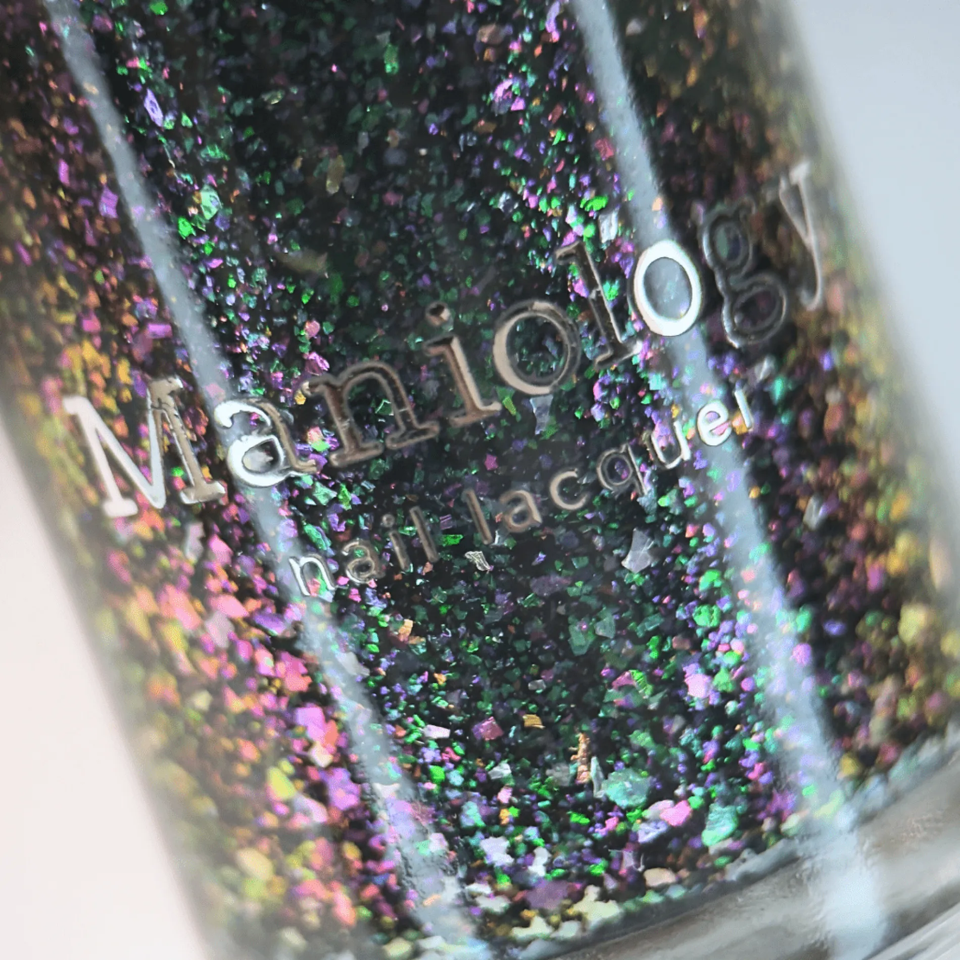 Spectral Shards (P188) - Sheer Tint Black with Green Iridescent Flakies Nail Polish