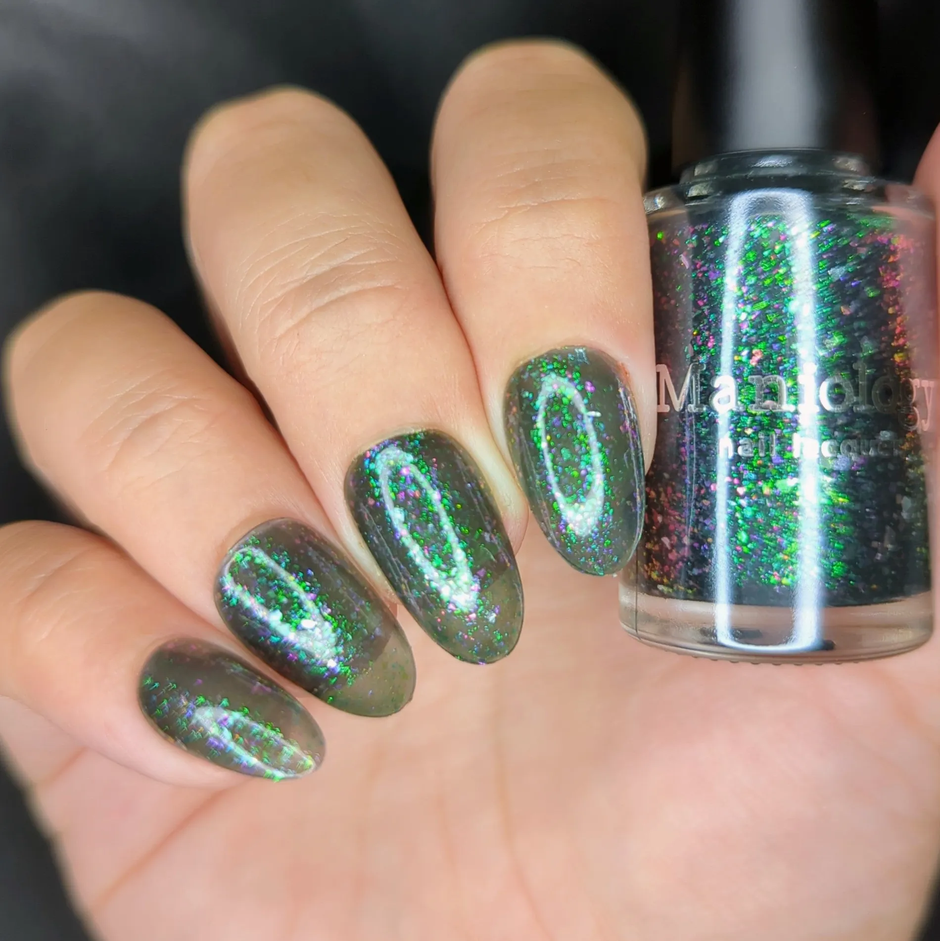 Spectral Shards (P188) - Sheer Tint Black with Green Iridescent Flakies Nail Polish